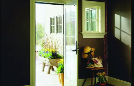 Open entry door with a view through to the garden