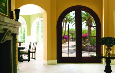 Arched double patio doors leading to a garden