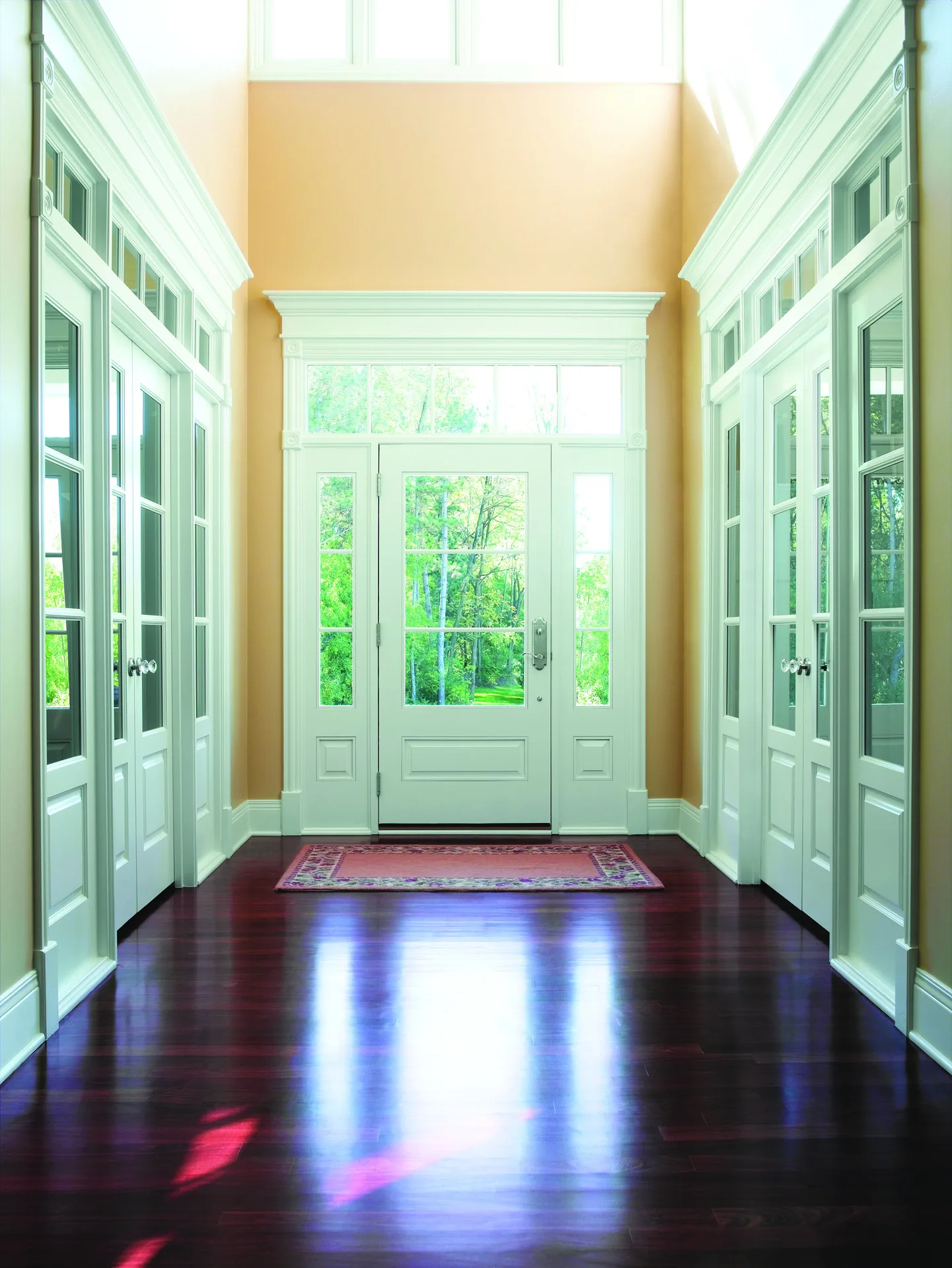 Interior doors with transoms opening off a bright Phoenix hallway