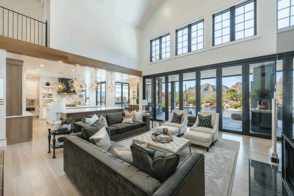 Two story great room with black framed windows