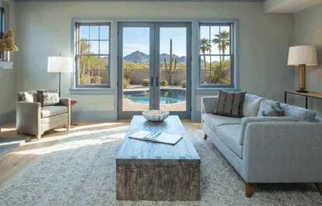 Living room with French doors framing a desert view