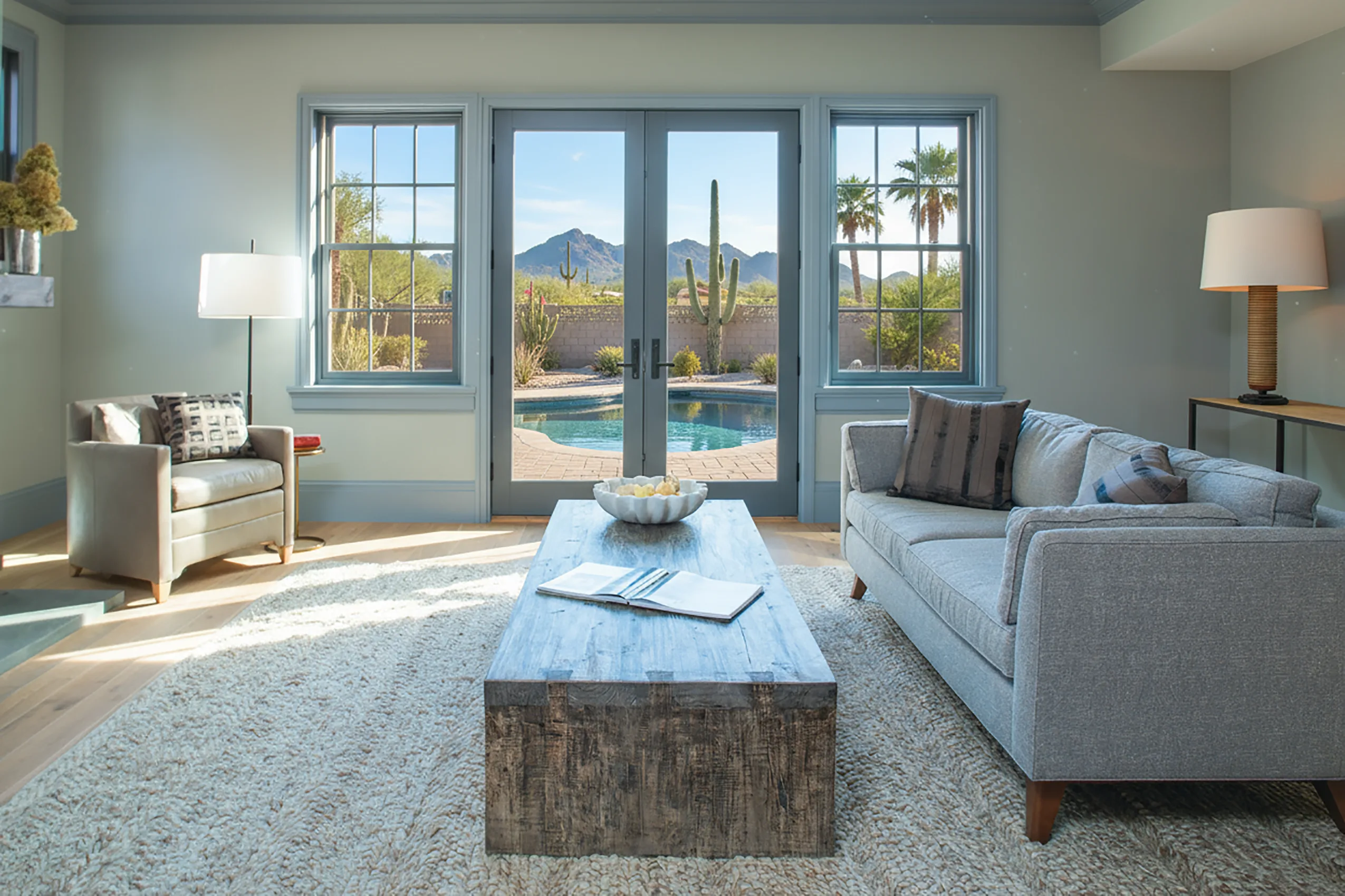 Living room with French doors framing a desert view