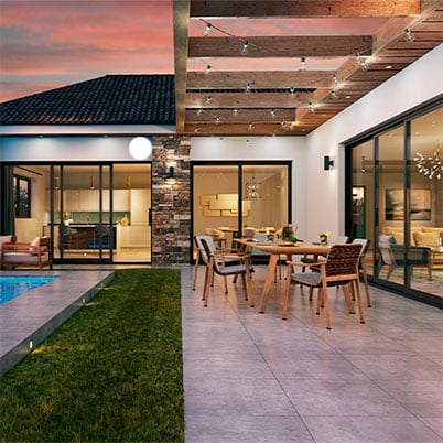 An Andersen aluminum multi-slide door opening a desert home onto a pool terrace