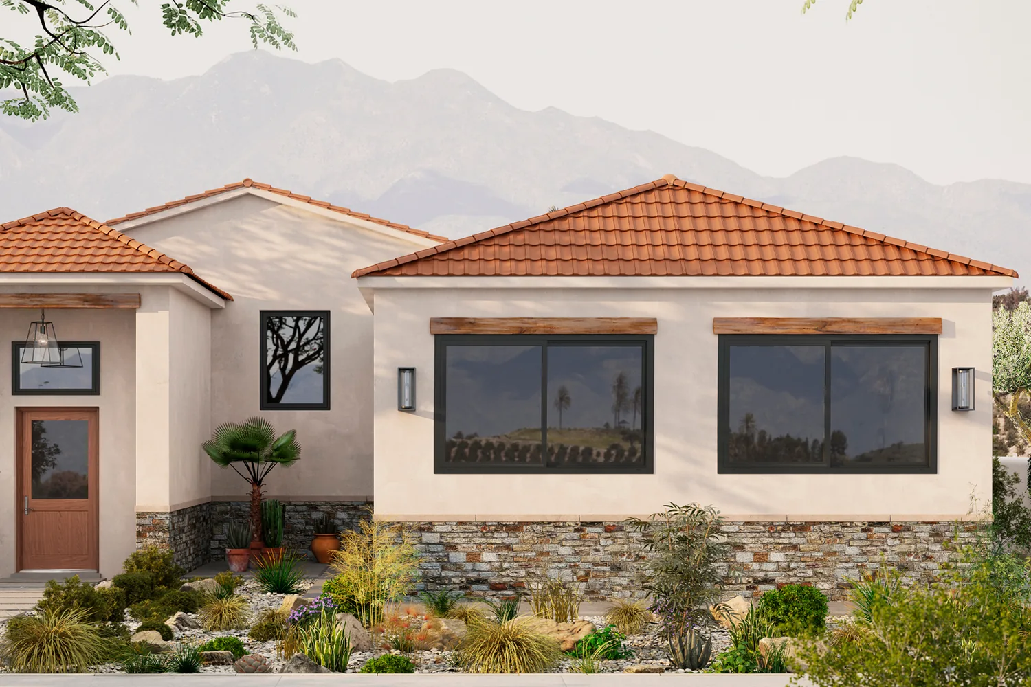 Single-story stucco home with a tile roof and wide black-framed sliding windows, desert planting in front and mountains behind