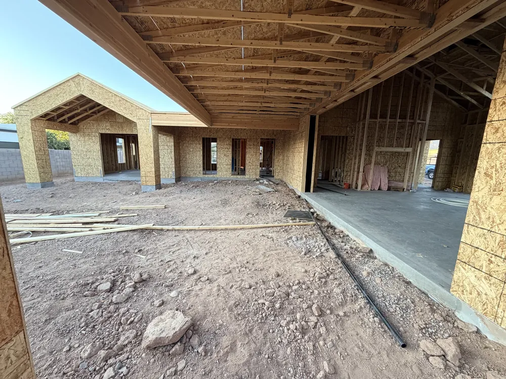 A wide exterior opening framed and carried on a structural header on a Noble project in progress