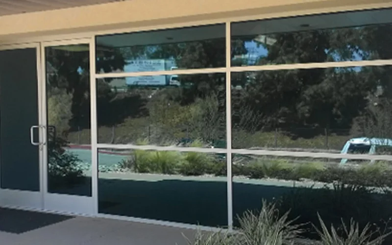 PRL commercial aluminum storefront window wall with an entrance door