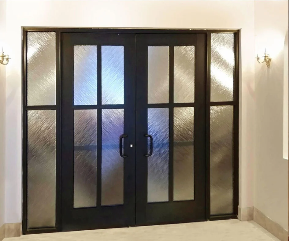 PRL Glass Systems black aluminum double doors with textured glass, flanked by matching sidelites