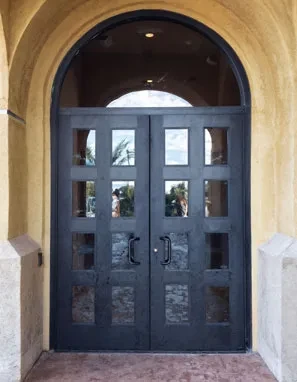 PRL Glass Systems custom aluminum double doors with divided glass under an arched transom