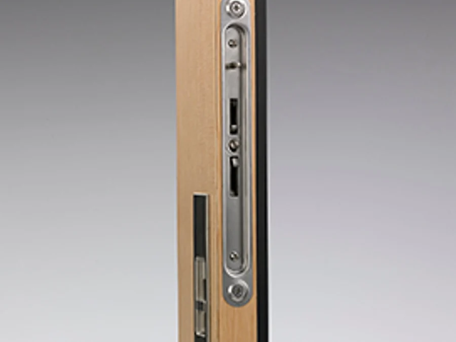 Two-point locking system on the lead panel of a stacking door, seen in the panel edge